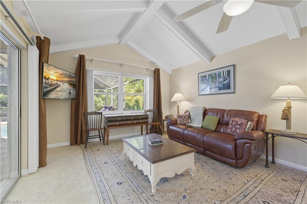 2261 Kings Lake Boulevard Naples, FL 34112 - Photo 15 of 43 a living room with furniture and a large window