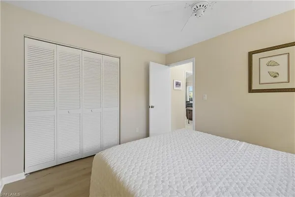 a bedroom with a bed and a shower