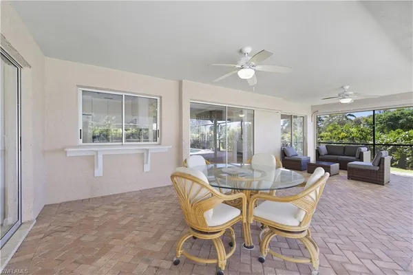 a dining room with furniture and window