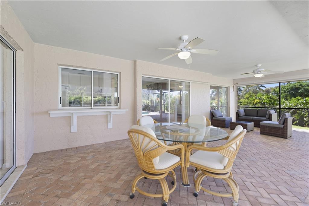 2261 Kings Lake Boulevard Naples, FL 34112 - Photo 31 of 43 a dining room with furniture and window