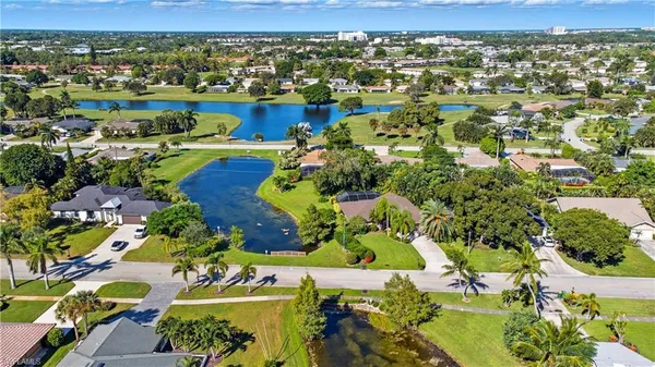 an aerial view of residential houses with outdoor space