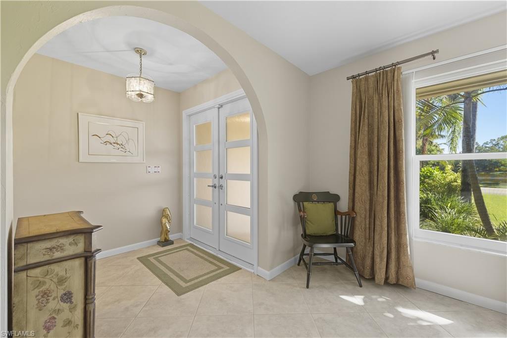2261 Kings Lake Boulevard Naples, FL 34112 - Photo 9 of 43 a view of a livingroom with furniture and windows