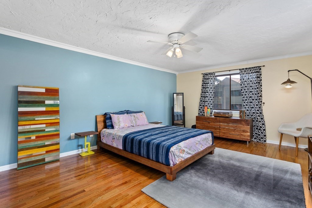 33 Trailside Way, Unit 33 Ashland, MA 01721 - Photo 11 of 26 a bedroom with a bed and wooden floor