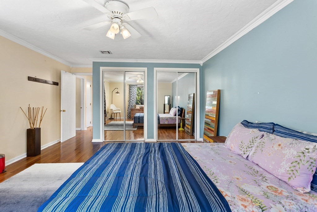 33 Trailside Way, Unit 33 Ashland, MA 01721 - Photo 12 of 26 a bedroom with a bed and wooden floor