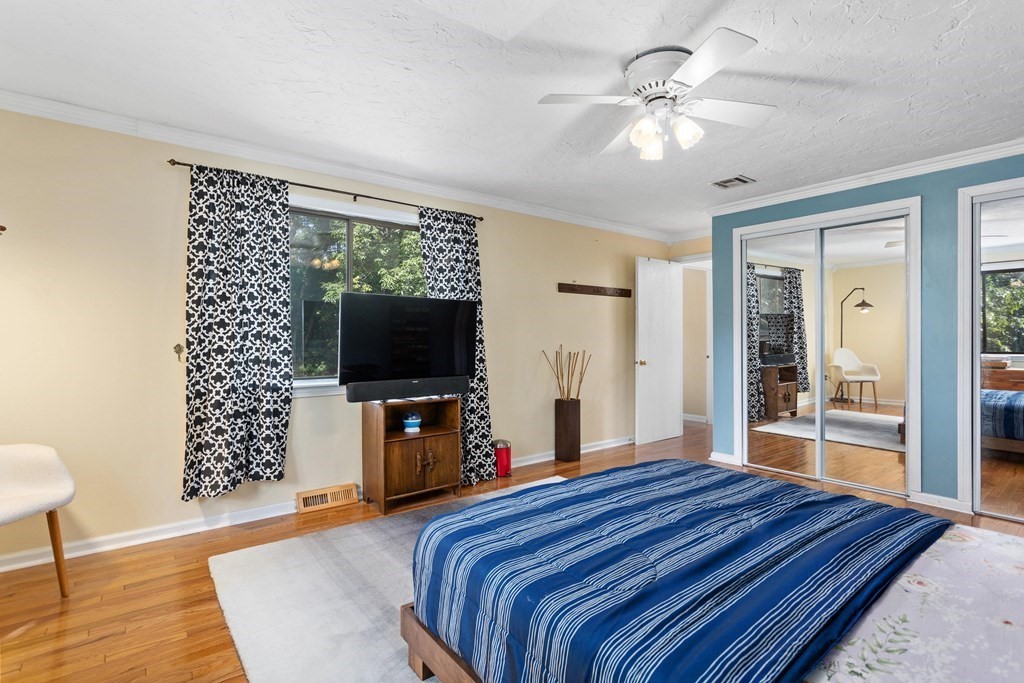 33 Trailside Way, Unit 33 Ashland, MA 01721 - Photo 13 of 26 a bedroom with a bed and a flat screen tv