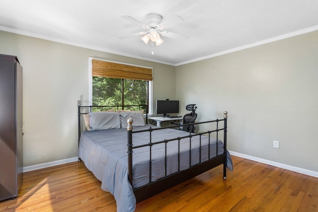 33 Trailside Way, Unit 33 Ashland, MA 01721 - Photo 16 of 26 a view of a bedroom with furniture window and wooden floor