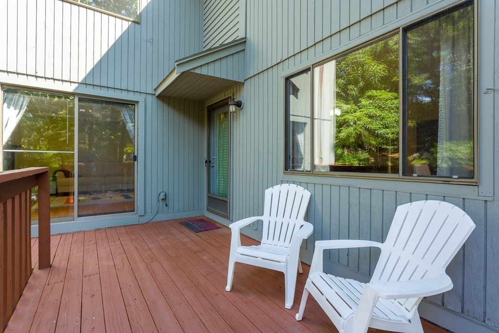 33 Trailside Way, Unit 33 Ashland, MA 01721 - Photo 21 of 26 a view of a chair and table in the balcony