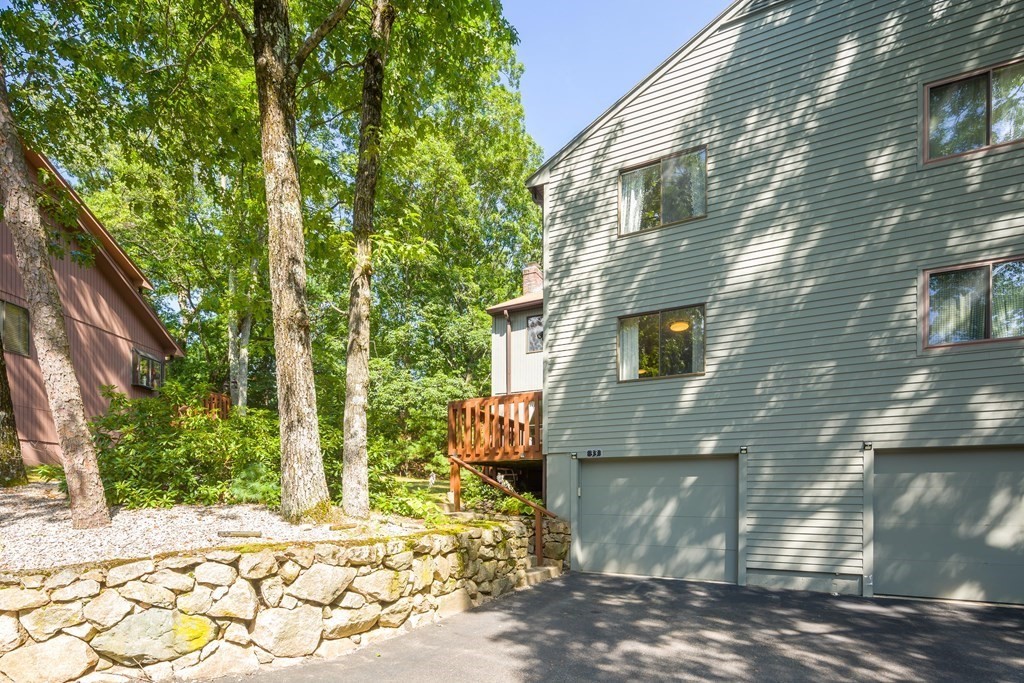 33 Trailside Way, Unit 33 Ashland, MA 01721 - Photo 24 of 26 a brick building with a tree in front