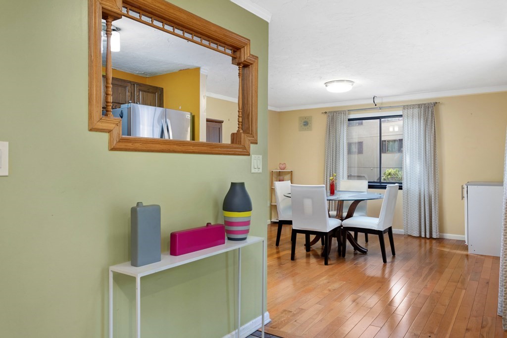 33 Trailside Way, Unit 33 Ashland, MA 01721 - Photo 3 of 26 a view of a dining room with furniture and wooden floor