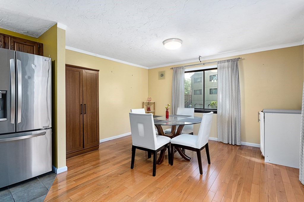 33 Trailside Way, Unit 33 Ashland, MA 01721 - Photo 5 of 26 a dining room with furniture and wooden floor