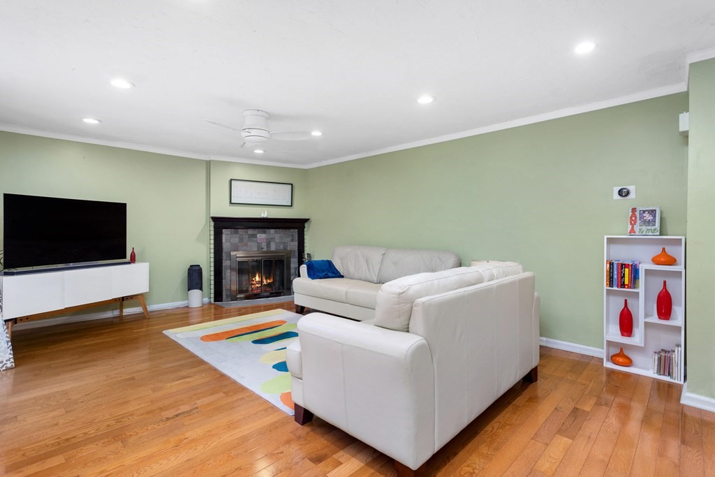 33 Trailside Way, Unit 33 Ashland, MA 01721 - Photo 6 of 26 a living room with furniture and a flat screen tv