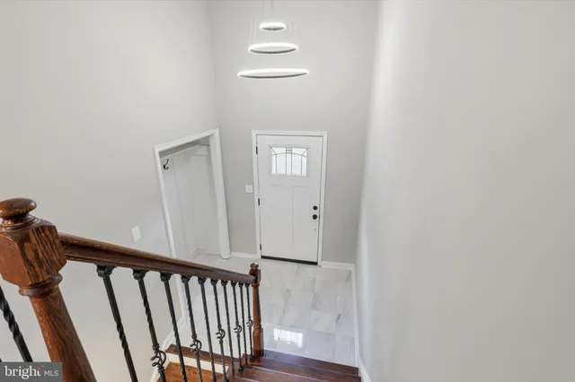 a living room with a fireplace and windows