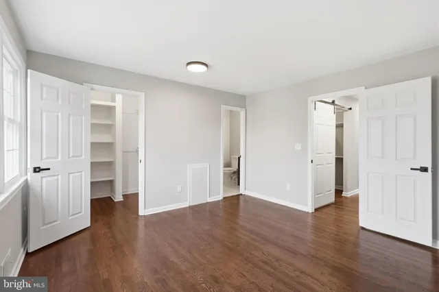 a view of an entryway with wooden floor