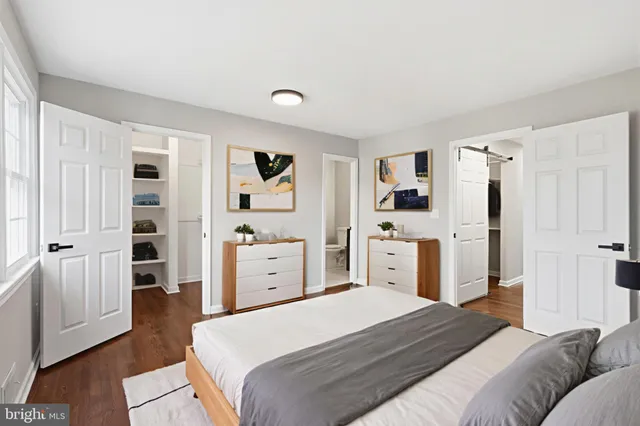 a bedroom with a large bed and a window