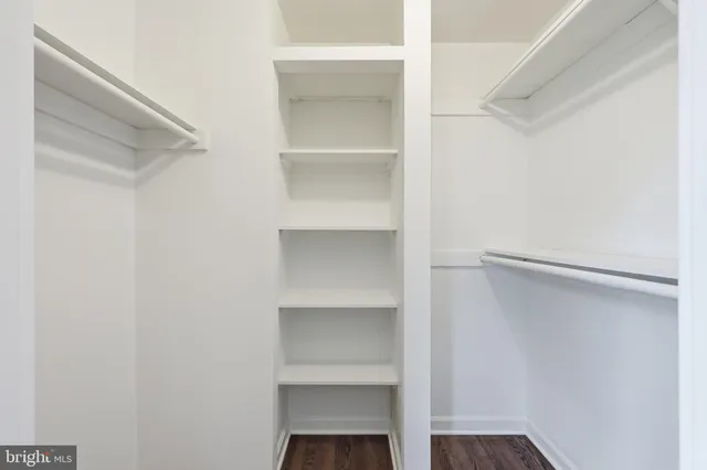 a bedroom with a bed and furniture