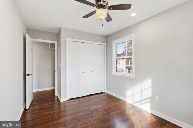 a view of a brick house with many windows