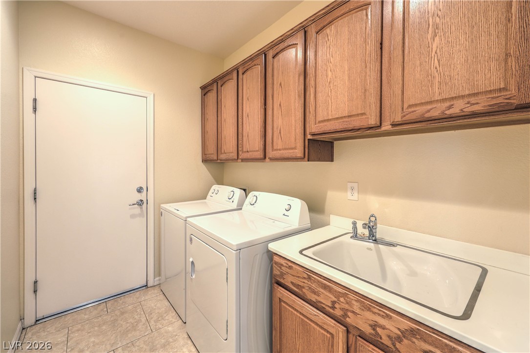 2276 Saxtons River Road Henderson, NV 89044 - Photo 26 of 49 Laundry Room with Cabinets, Utility Sink, and Washer & Dryer (gas and electric hookups)