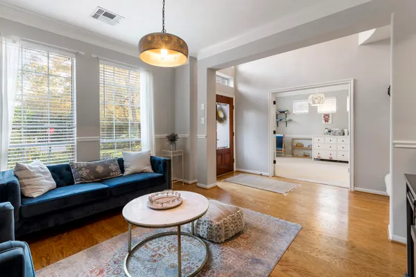 a living room with furniture and a large window