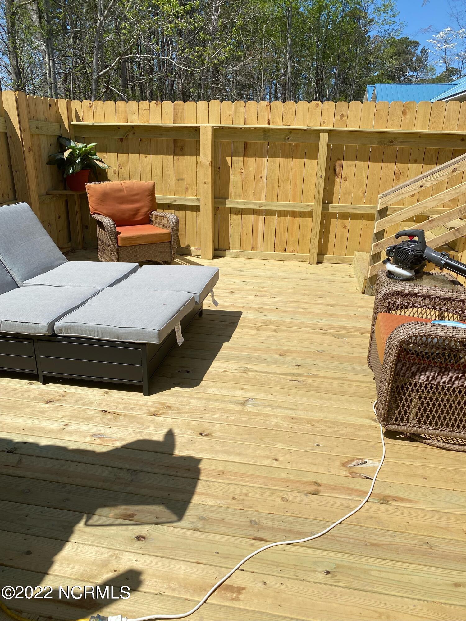 214 Manchester Road Havelock, NC 28532 - Photo 46 of 54 In season photo of the back deck sitting and grilling area.