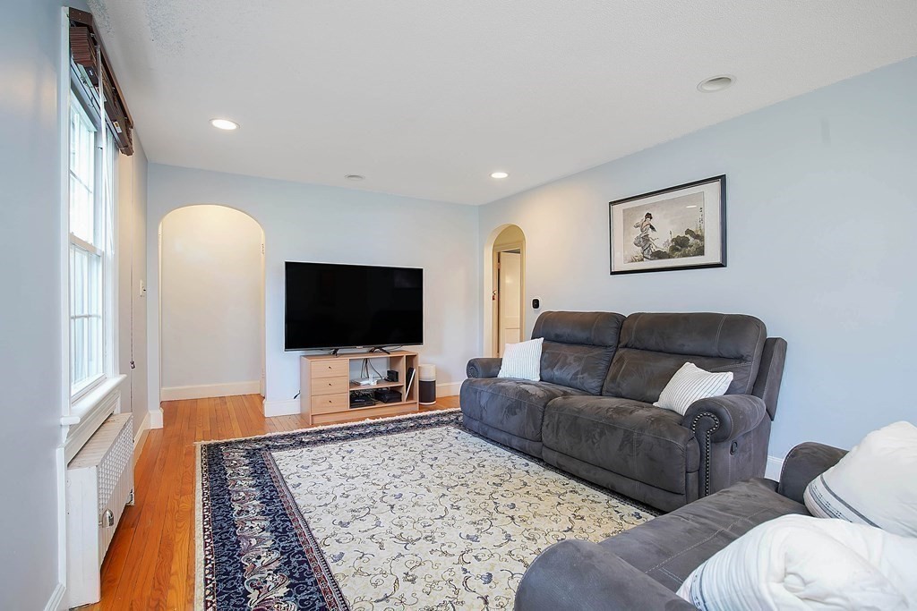 105 Lancaster Street Springfield, MA 01118 - Photo 12 of 38 a living room with furniture and a flat screen tv