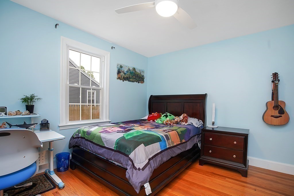 105 Lancaster Street Springfield, MA 01118 - Photo 19 of 38 a bedroom with a bed and window