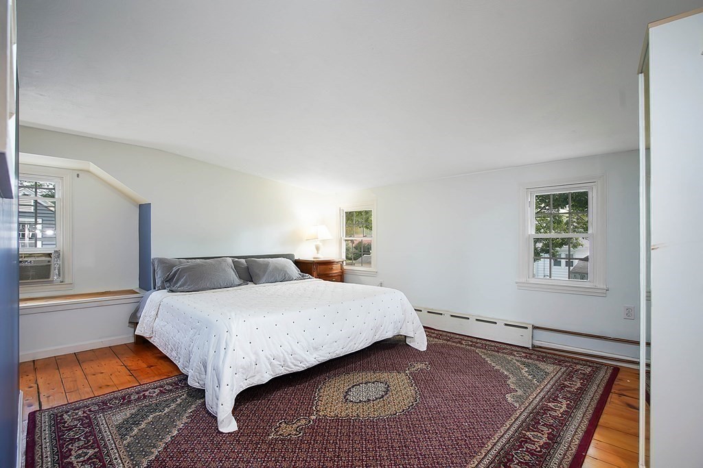 105 Lancaster Street Springfield, MA 01118 - Photo 24 of 38 a bedroom with a bed and a rug