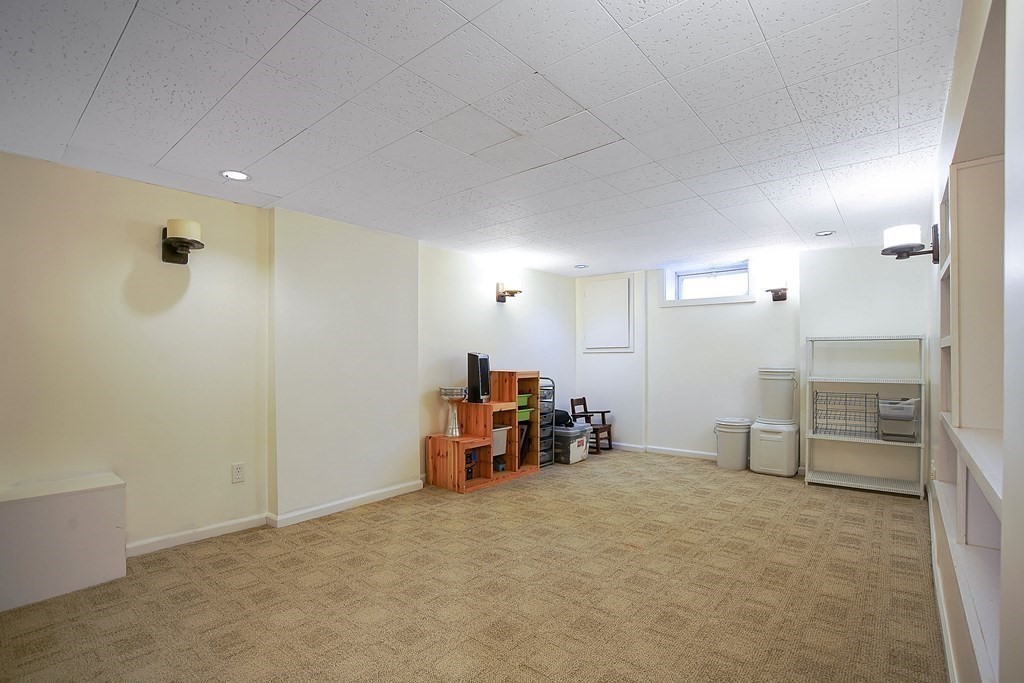 105 Lancaster Street Springfield, MA 01118 - Photo 28 of 38 an empty room with furniture and natural light
