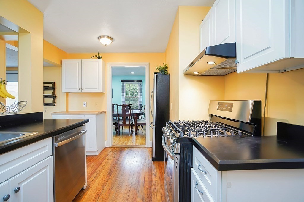 105 Lancaster Street Springfield, MA 01118 - Photo 6 of 38 a kitchen with counter top space cabinets and stainless steel appliances