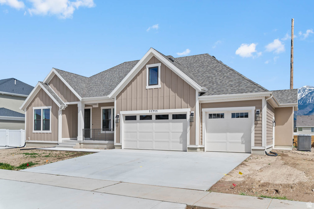 11711 South Halls Crk Road Draper, UT 84020 - Photo 2 of 31 Craftsman inspired home with concrete driveway, roof with shingles, a porch, an attached garage, and board and batten siding