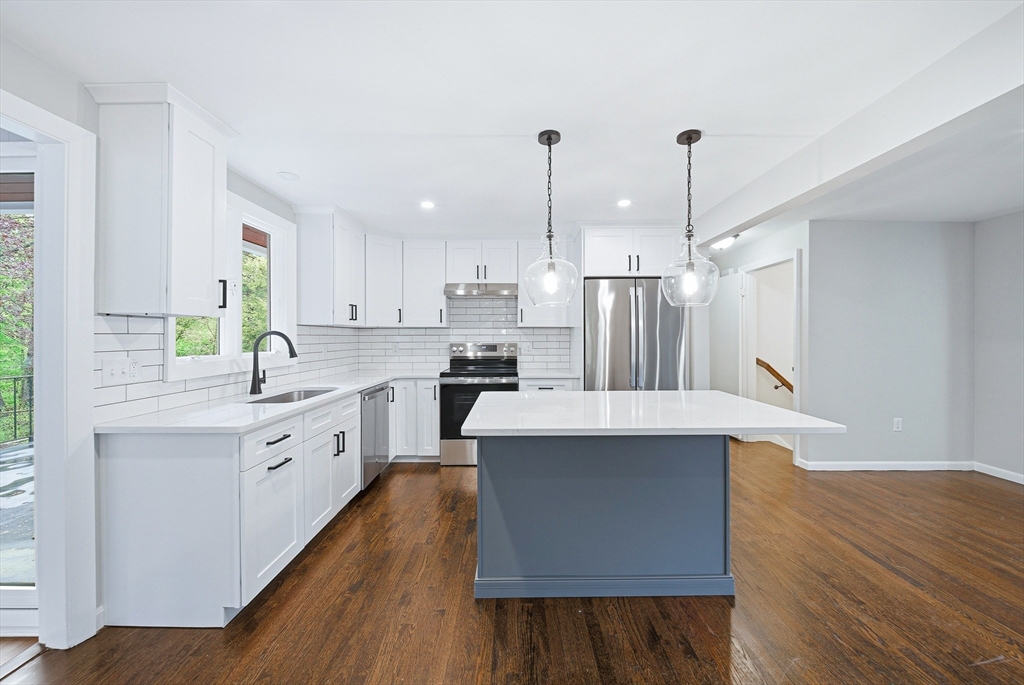1 Ayrshire Road Worcester, MA 01604 - Photo 8 of 41 a kitchen with stainless steel appliances kitchen island a hardwood floor and a sink