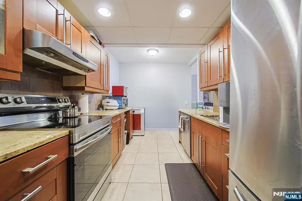 a bathroom with a sink a toilet a shower and a mirror