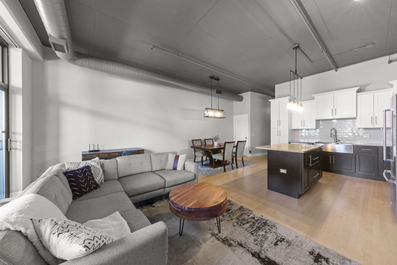 1301 West Madison Street, Unit 305 Chicago, IL 60607 - Photo 10 of 22 a living room with furniture and a large window