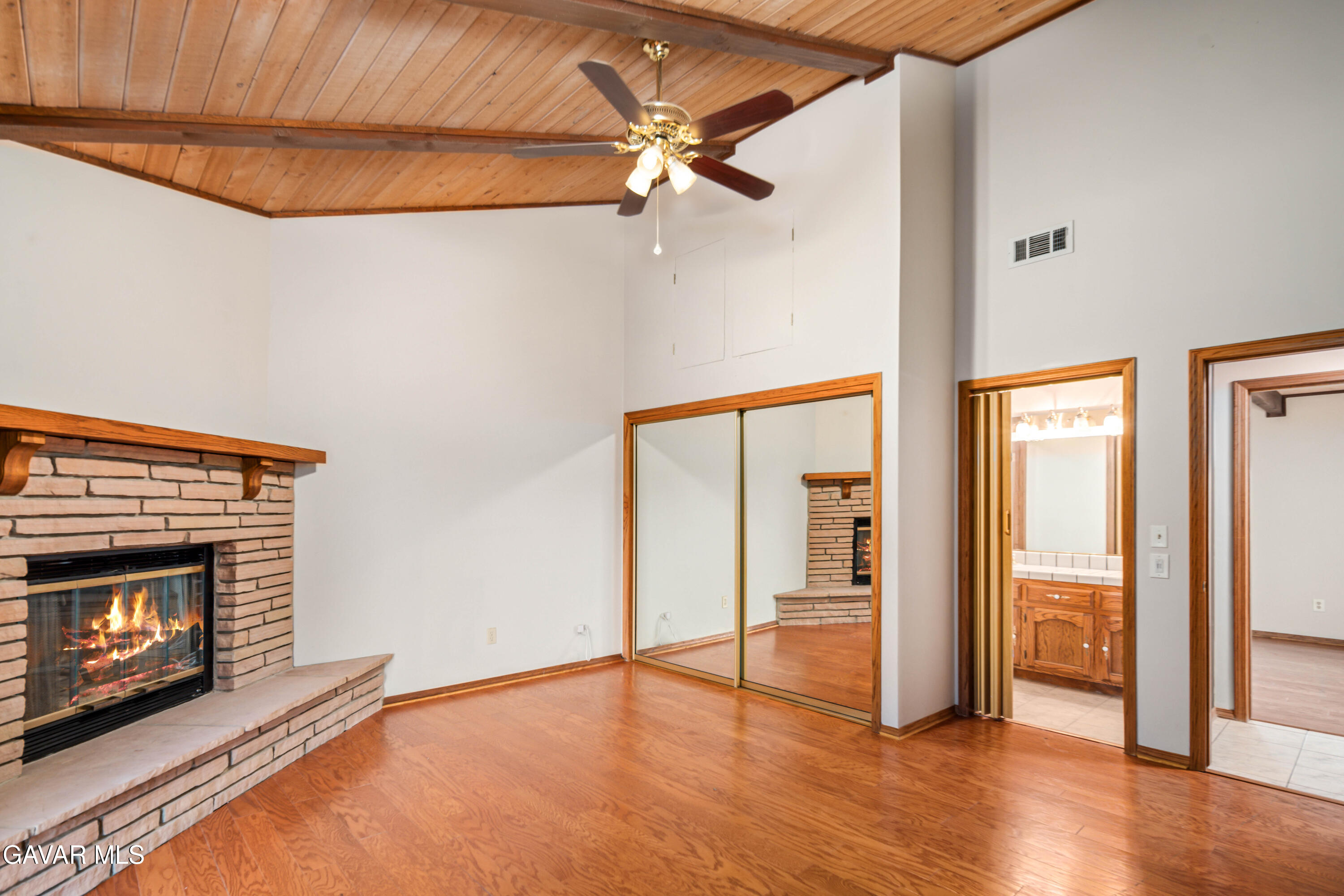 24050 Basin Harbor Court Tehachapi, CA 93561 - Photo 20 of 55 a view of an empty room with a fireplace and a window