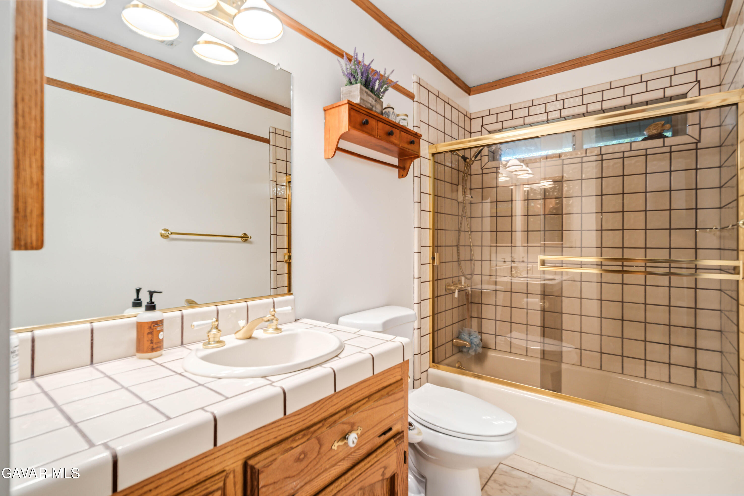 24050 Basin Harbor Court Tehachapi, CA 93561 - Photo 24 of 55 a bathroom with a sink a toilet and shower