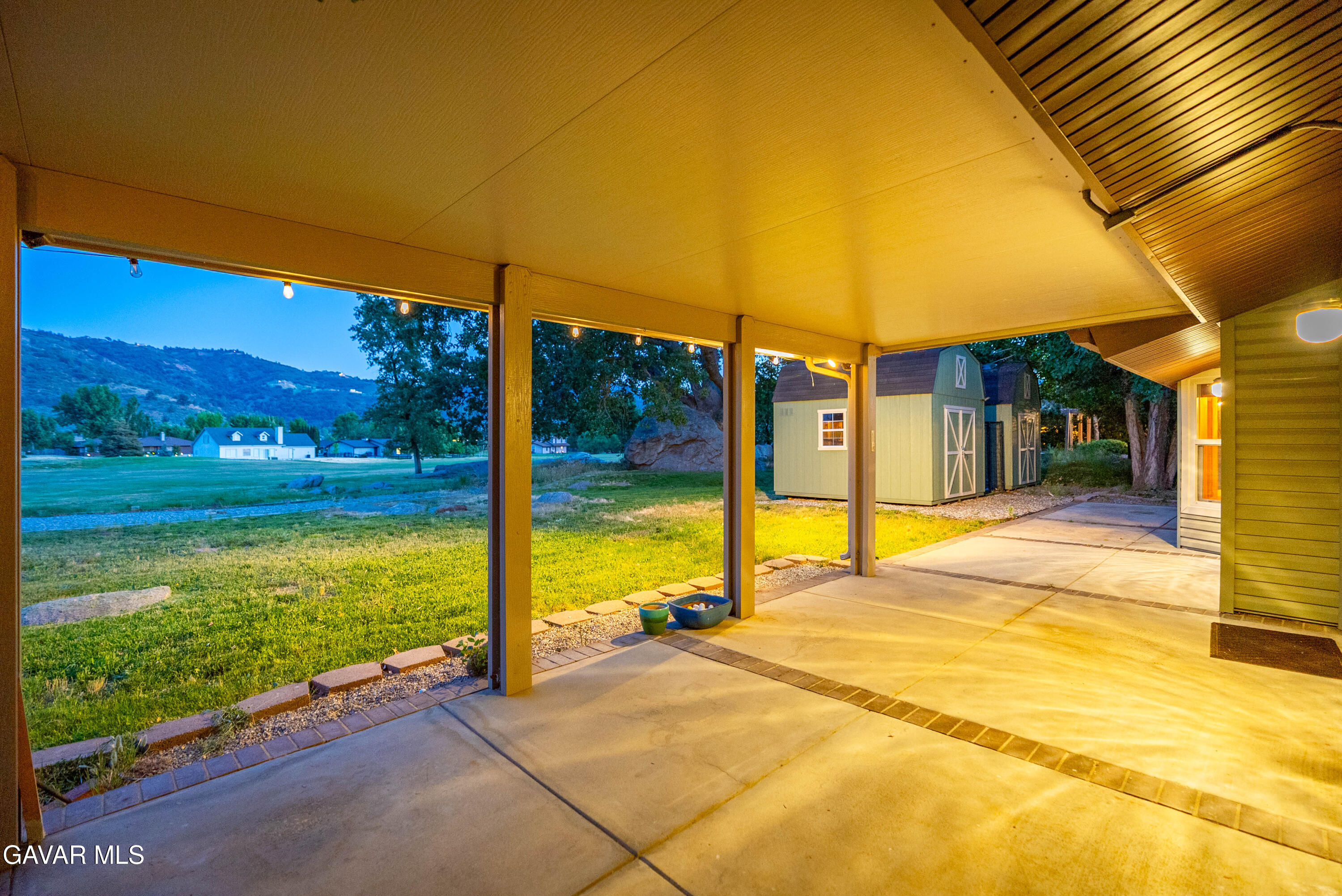 24050 Basin Harbor Court Tehachapi, CA 93561 - Photo 27 of 55 a view of swimming pool with lawn chairs under an umbrella
