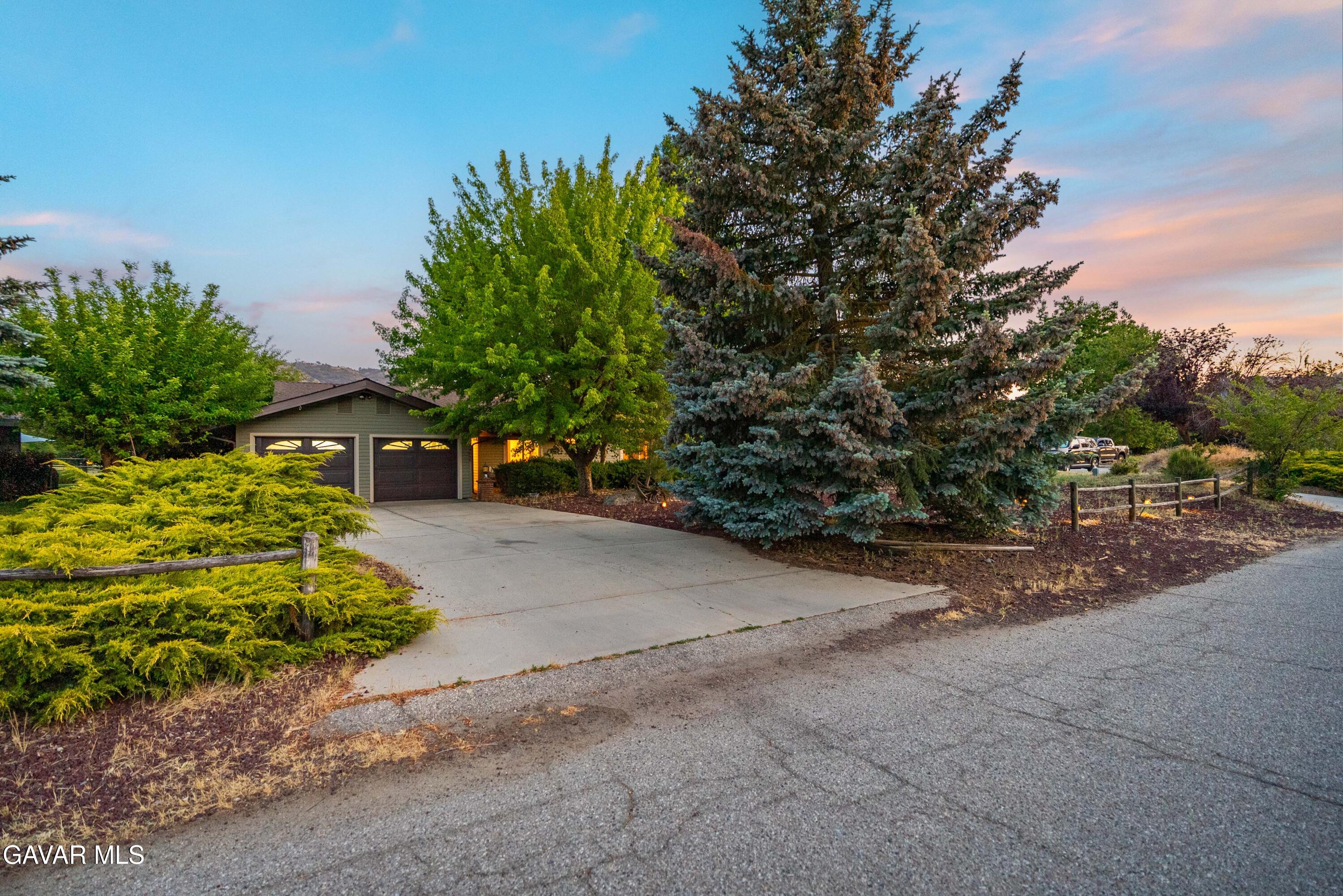 24050 Basin Harbor Court Tehachapi, CA 93561 - Photo 3 of 55 a view of road with large trees