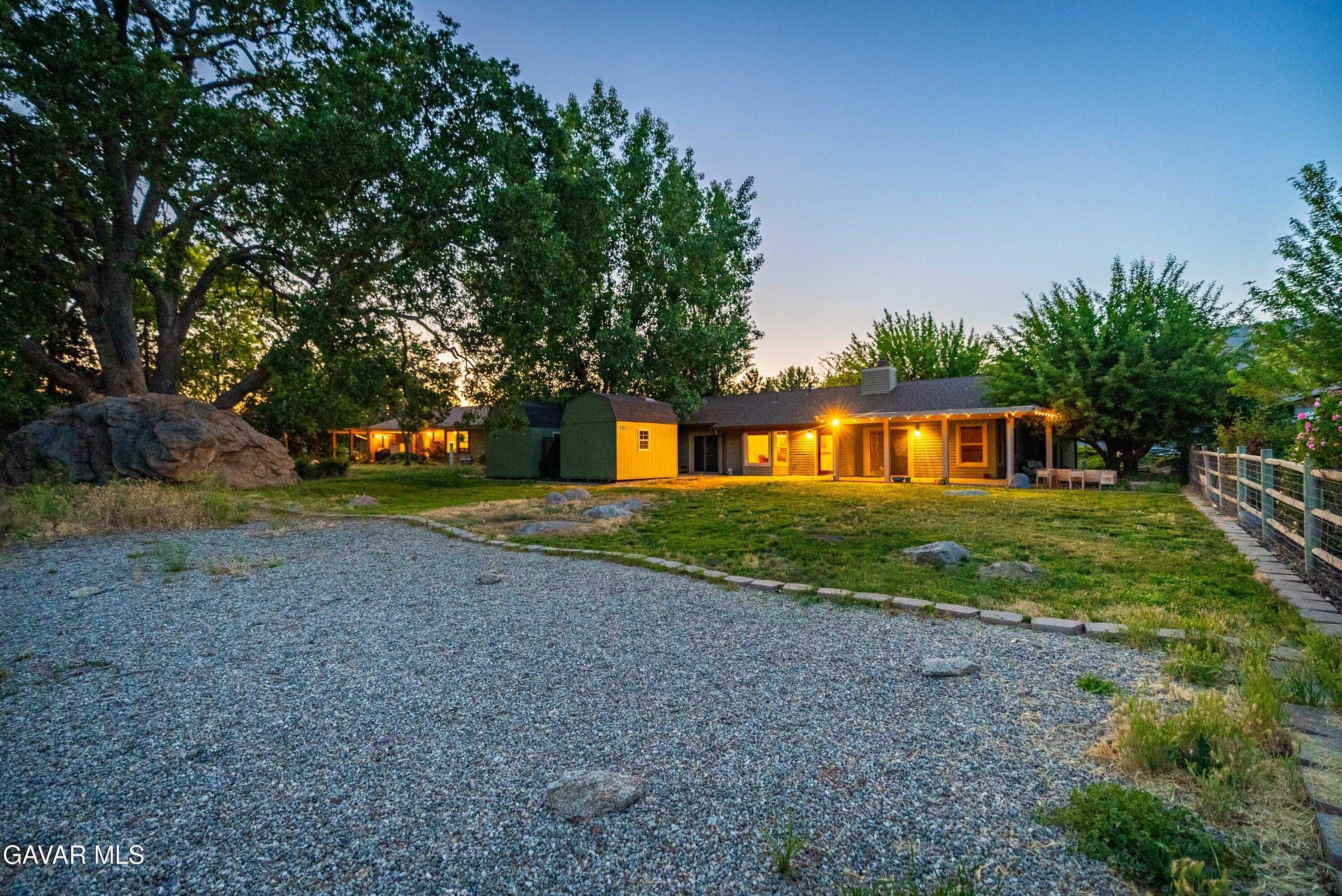 24050 Basin Harbor Court Tehachapi, CA 93561 - Photo 32 of 55 a front view of a house with a yard