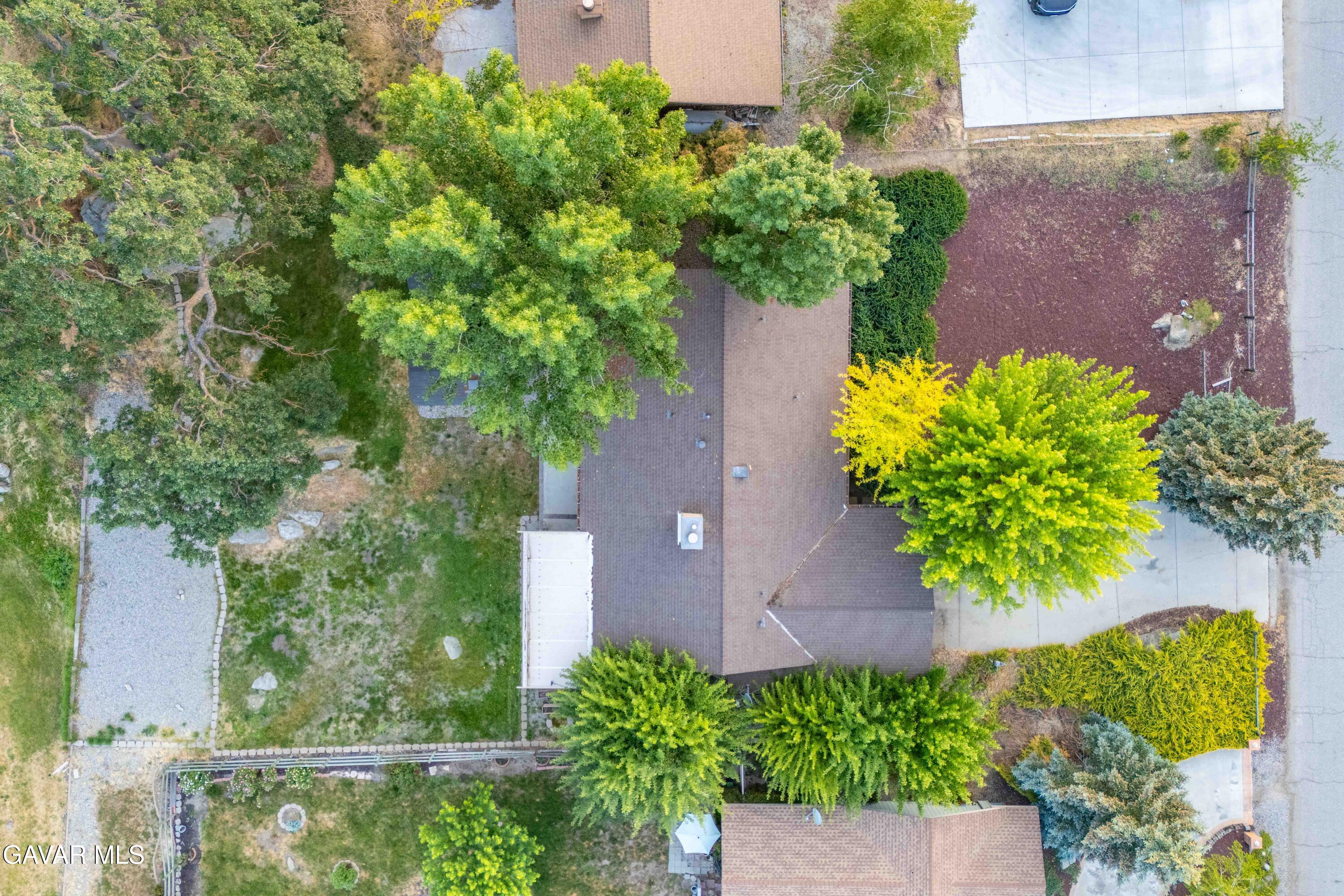 24050 Basin Harbor Court Tehachapi, CA 93561 - Photo 43 of 55 an aerial view of a house with a yard and a garden