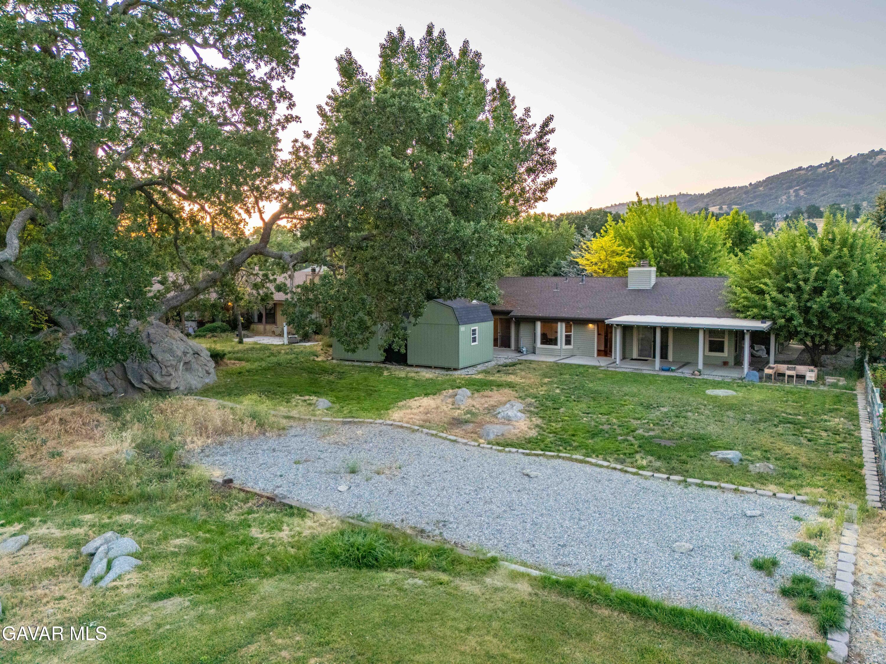 24050 Basin Harbor Court Tehachapi, CA 93561 - Photo 44 of 55 a view of a house with a yard
