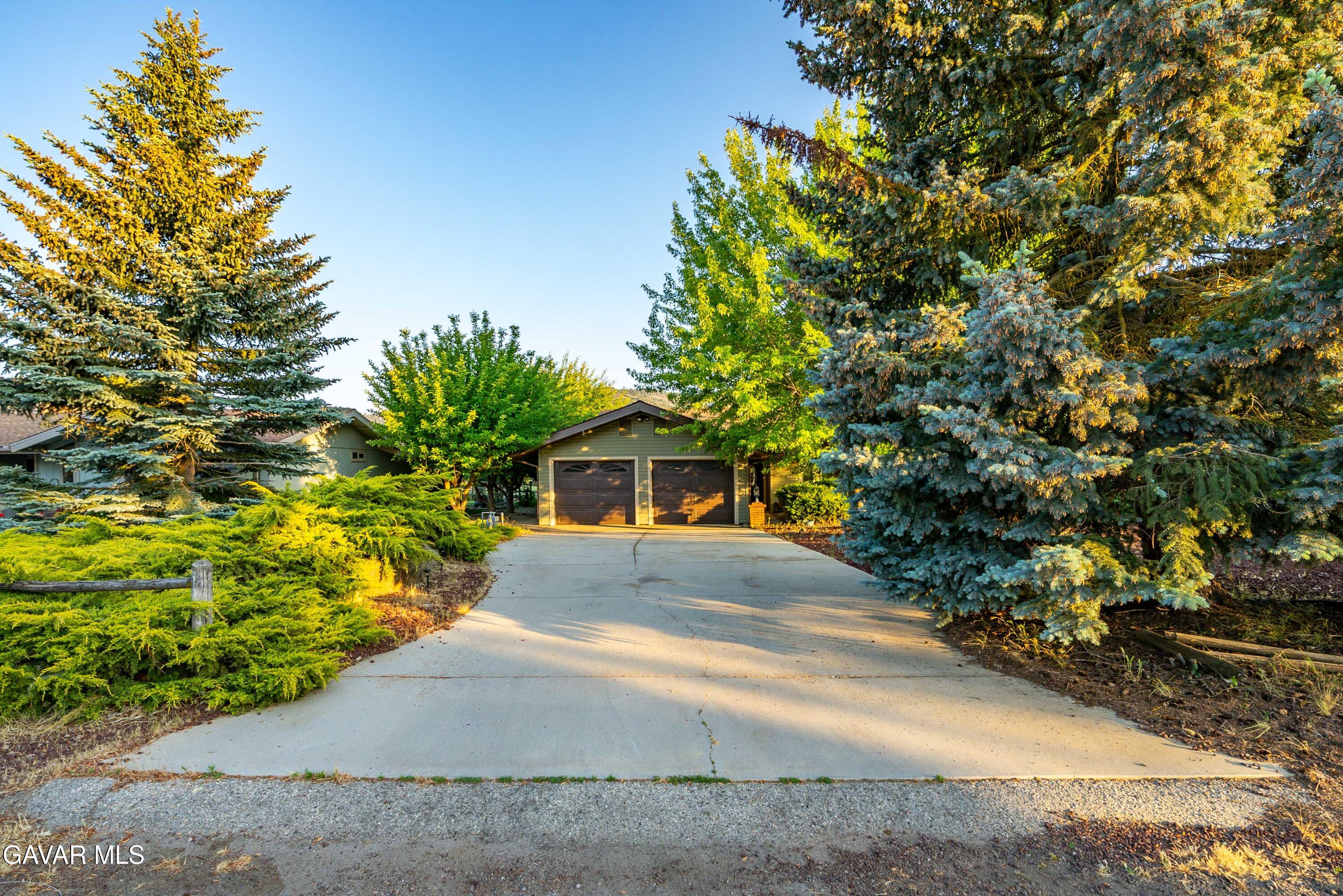 24050 Basin Harbor Court Tehachapi, CA 93561 - Photo 53 of 55 a front view of a house with a yard