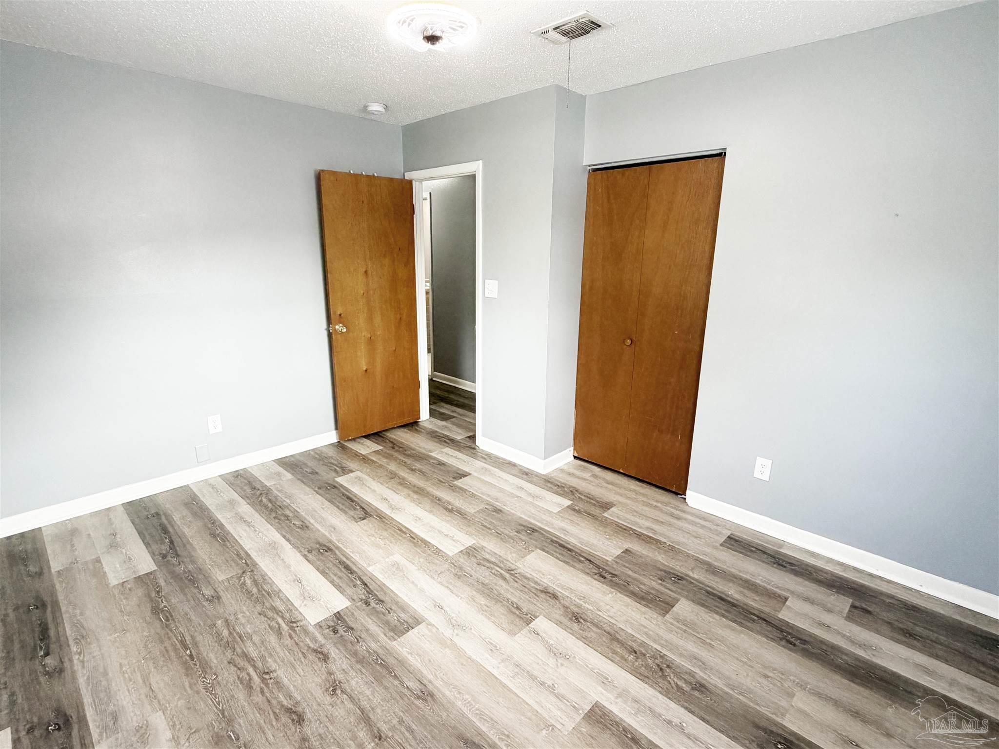 2053 Tomlinson Road Pensacola, FL 32526 - Photo 16 of 27 a view of a room with wooden floor