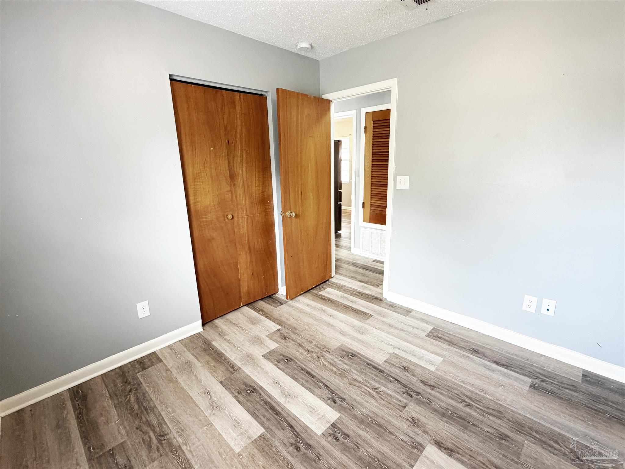 2053 Tomlinson Road Pensacola, FL 32526 - Photo 18 of 27 a view of a room with wooden floor and a window