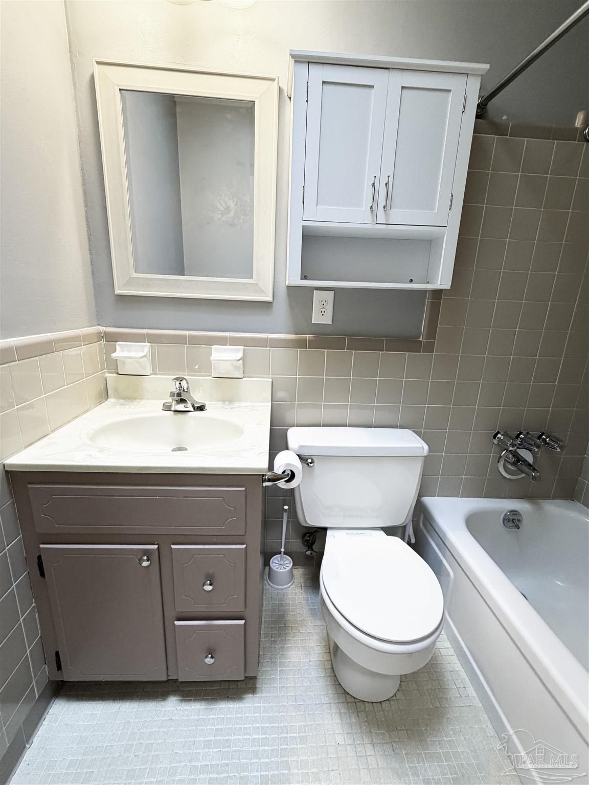 2053 Tomlinson Road Pensacola, FL 32526 - Photo 19 of 27 a bathroom with a sink a toilet and bathtub