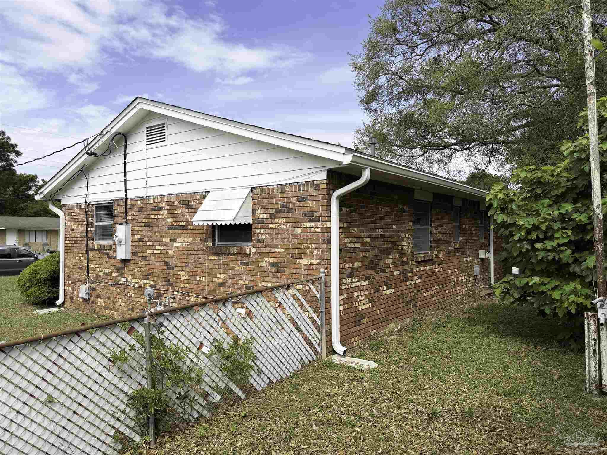 2053 Tomlinson Road Pensacola, FL 32526 - Photo 22 of 27 a front view of a house with garden