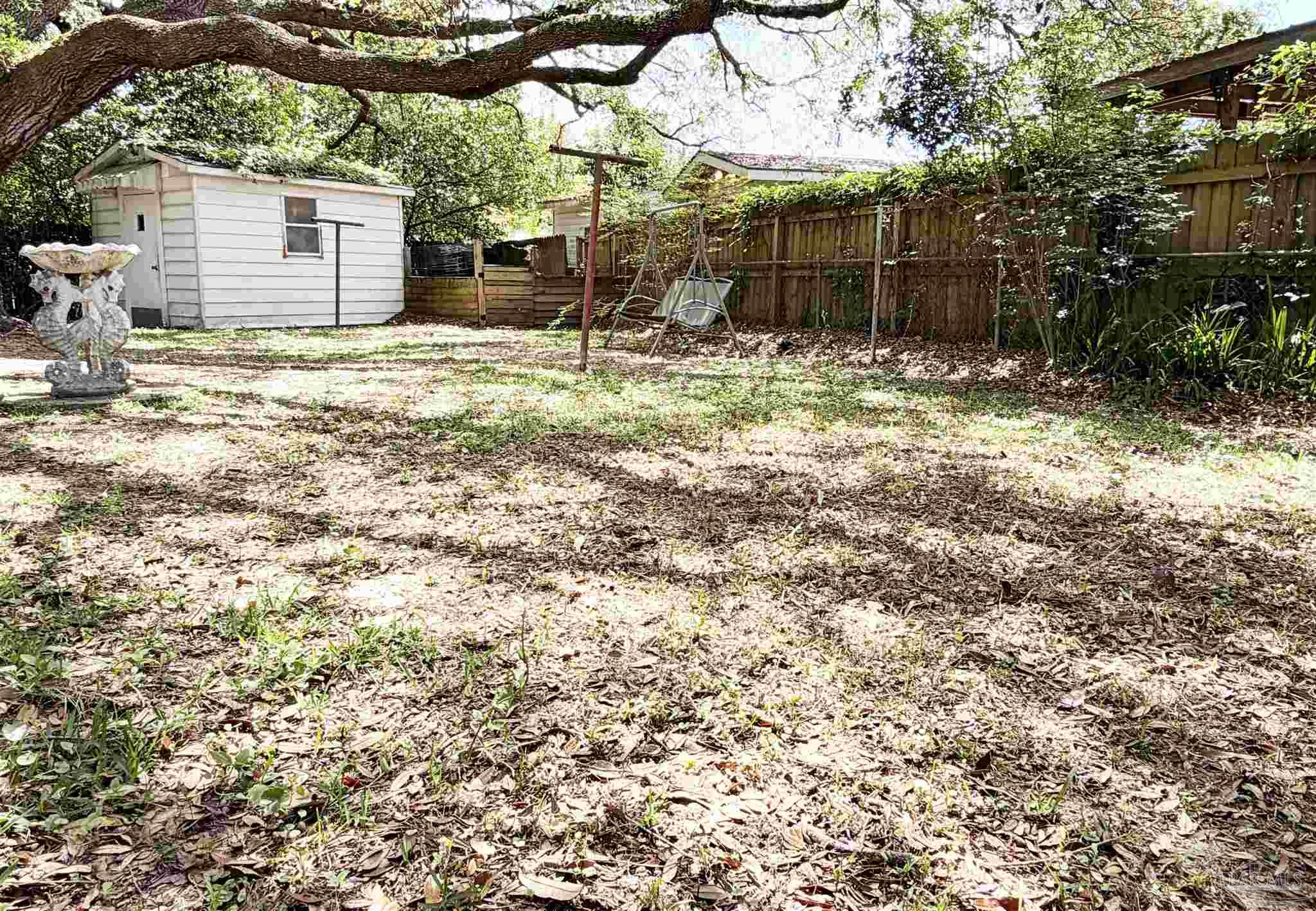 2053 Tomlinson Road Pensacola, FL 32526 - Photo 23 of 27 a backyard of a house