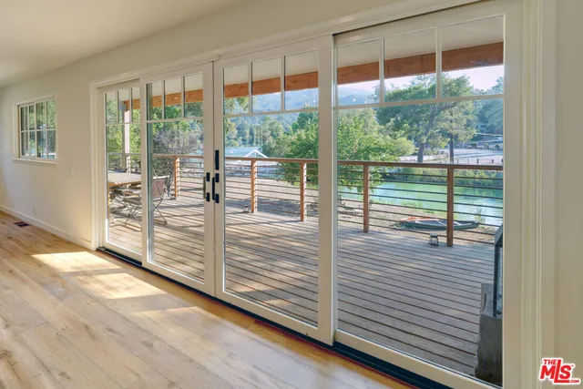 a kitchen with stainless steel appliances granite countertop a stove and a wooden floors