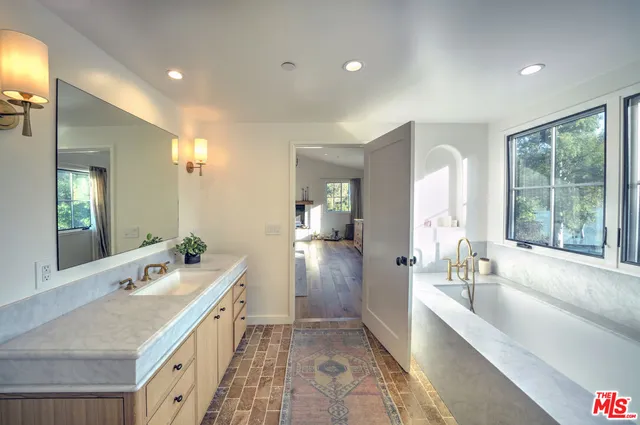 a bathroom with a bathtub and a shower