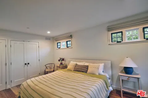 a bathroom with a sink mirror and shower