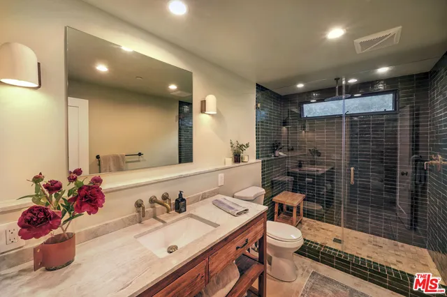 a hotel room with a bed and furniture