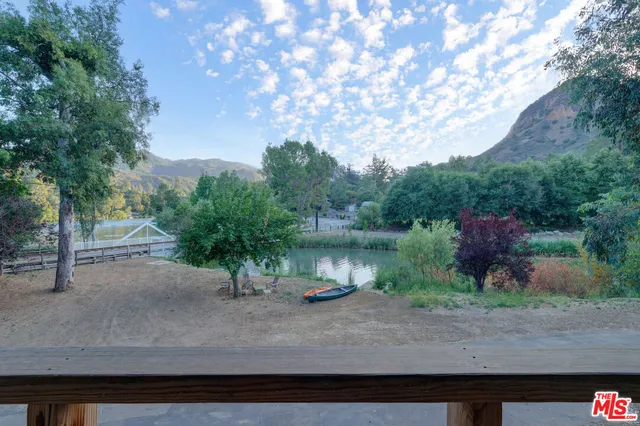 a view of balcony with couch and wooden floor